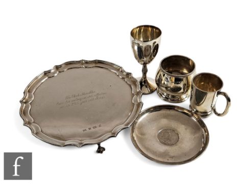 A small parcel lot of hallmarked silver items to include a salver, a small tankard, a dish with central Churchill crown, a go