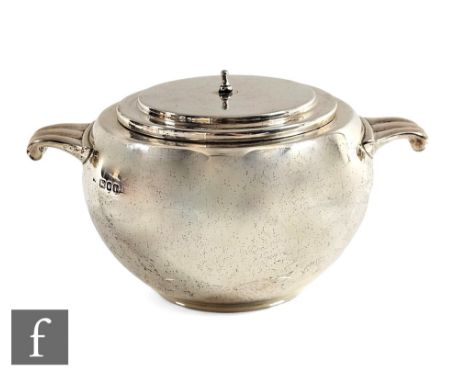 An Art Deco hallmarked silver bomb shaped twin handle sugar basin of plain form, lacking finial, weight 18oz, height 10cm, Lo