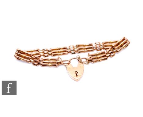 A 9ct rose gold three bar gate bracelet, weight 10g, terminating in a padlock fastener. 