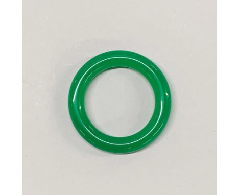 A Chinese apple green jade bangle, Dia. 1.5cm internal Dia. 5.8cm.