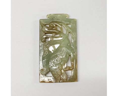 A Chinese carved celadon green nephrite jade panel of a crane, 9 x 4.5cm.
