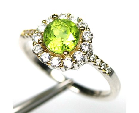 A 925 cluster ring set with peridot and white stones, (P).