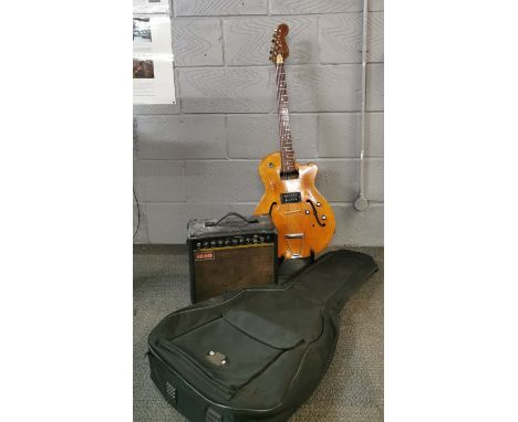 A vintage electric guitar and case with guitar stand and a Rhino amplifier.