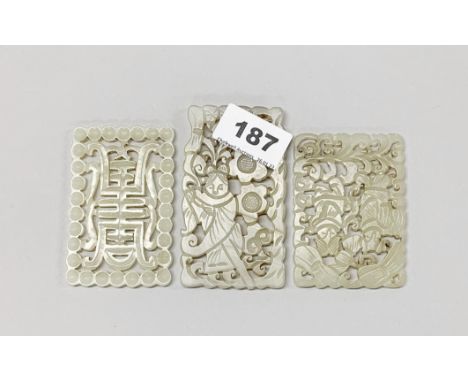 A group of three Chinese carved nephrite jade double sided panels, 5.5 x 8.5cm.