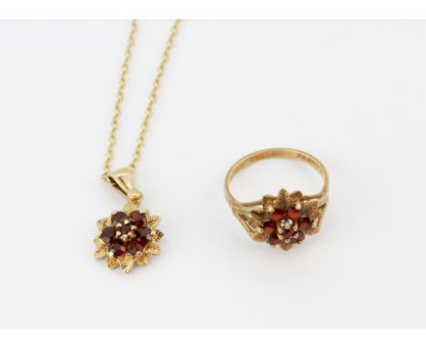 A hallmarked 9ct yellow gold flower shaped ring set with round cut garnets, (M.5) together with a matching 9ct yellow gold pe