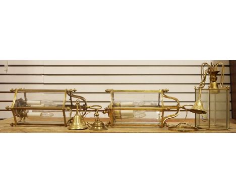 A pair of brass and glass hall lanterns, 49cm each approx. and another brass and glass hall lantern(3)