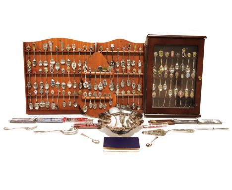 Large collection of souvenir spoons with display shelves in cabinets and assorted flatware, some odd pieces of silver-plated 