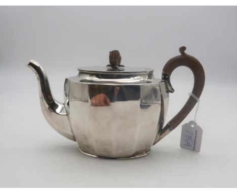 A silver teapot, of faceted oval form, with a carved pineapple finial, by Mappin &amp; Webb, Sheffield 1933 Condition Report: