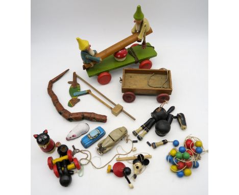 A collection of vintage toys, including an incomplete Pelham Minnie Mouse puppet, a Shuco clockwork car, other unmarked clock