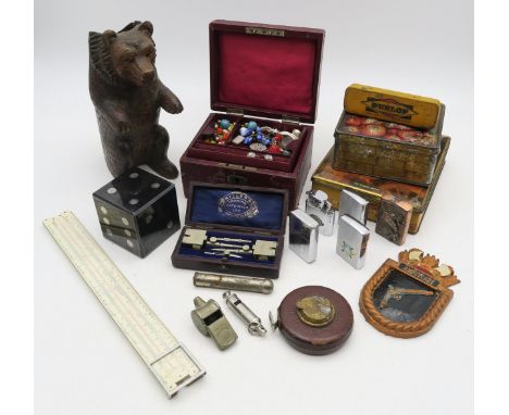 An eclectic mixed lot, comprising Black Forest-style bear taper holder, 33ft leather-cased tape measure by Chesterman of Shef