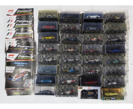 A quantity of Formula 1: the Car Collection&nbsp;model cars by Panini, still packaged, with corresponding magazines; and a sm