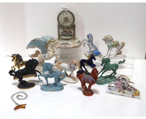 A collection of unicorn figures including Franklin Mint and a merry go round clock Condition Report:Available upon request