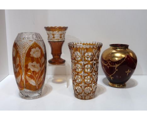 Three amber flashed and cut glass vases together with a ruby and gilt vase Condition Report:Available upon request