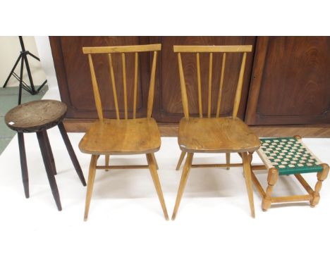 A pair of mid 20th century elm and beech Ercol model 608 rail back chairs, carved circular topped stool and a strung stool (4