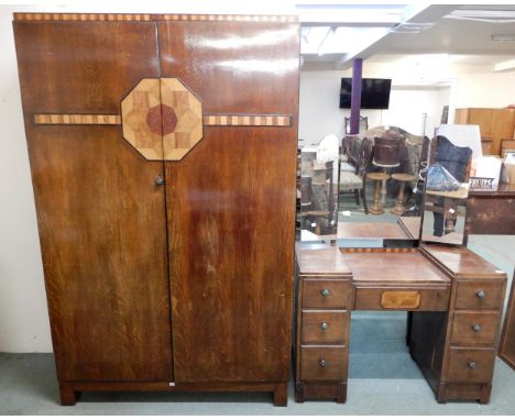 An early 20th century art deco oak two piece bedroom suite comprising two door wardrobe, 194cm high x 122cm wide x 51cm deep 