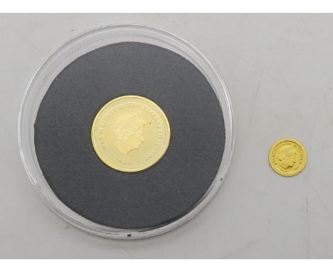 THE CENTANARY OF WW1 GOLD SOLID GOLD COIN 2014 1 gram together with a HALF CROWN ELIZABETH 2009 0.25 gram Condition Report:Av