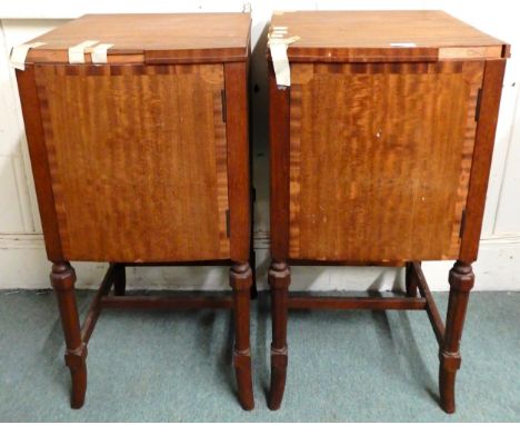 A pair of 20th century mahogany single door bedside cabinets on stretchered shaped supports, 78cm high x 40cm wide x 40cm dee