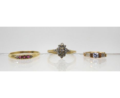 A yellow metal diamond cluster ring, size M, weight 1.3gms, together with a single 14k cz set earring and a ruby and 14k diam