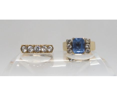 A 9ct gold retro blue and clear gem set ring, size R, and a 9ct clear gem set ring, size N, weight together 5.4gms Condition 
