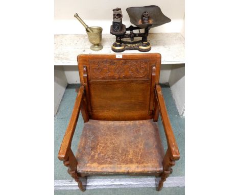 A 20th century oak metamorphic monks chair/table, cast iron table top scales, weights and brass mortar and pestle (3) Conditi