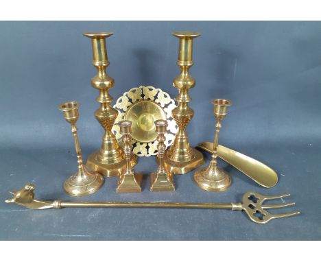 A quantity of brass items to include: 2 large candle sticks, 25cm high, 2 medium sized candlesticks 15cm high, 2 small candle