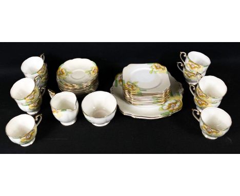 A part tea service in BELL CHINA with hand-painted accents comprising 10 cups, 12 saucers, 12 side plates, 2 cake/sandwich pl