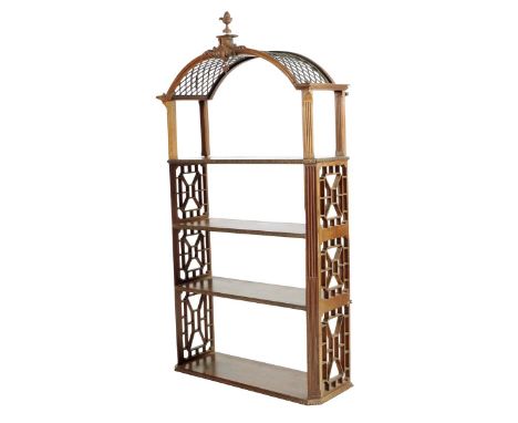 A set of George III mahogany hanging wall shelves in Chinese Chippendale style, the arched top with fret panels and a scroll 