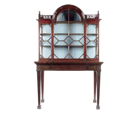 A George III mahogany breakfront 'Chinese Chippendale' style display cabinet, with a fret carved gallery with turned finials 