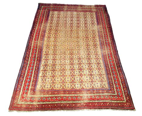 An Indian carpet, with a yellow ground, early 20th century, 453 x 320cm.