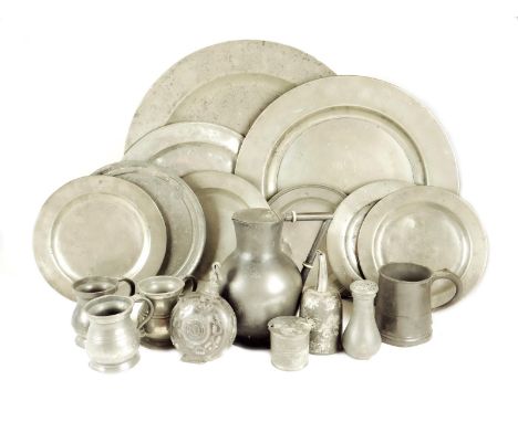 A collection of pewter, comprising: two chargers, six platters two with triad owner's initials, one by Samuel Ellis, London, 