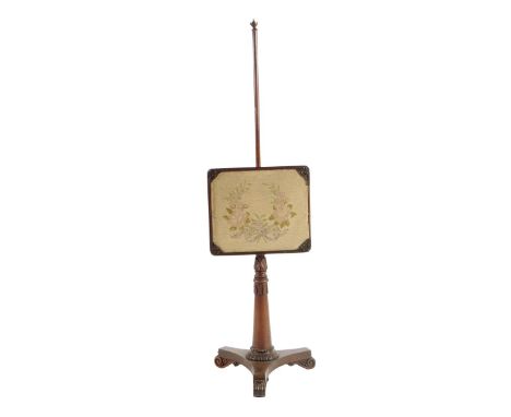 λ A Regency rosewood pole firescreen, with a needlework panel on a leaf carved stem and with scroll feet, 137.5cm high, 42.5c