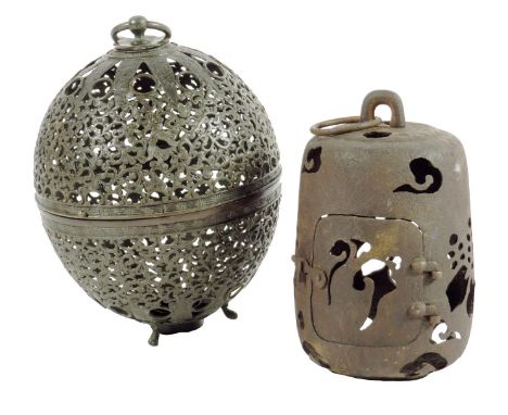 An oriental bronze globe shape hanging incense burner or dowry lantern, with pierced decoration of scrolling leaves with styl