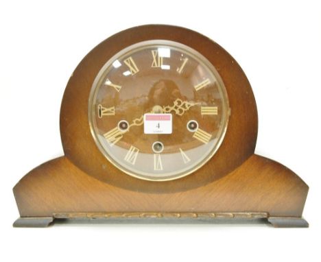 A walnut cased striking and chiming mantel clock 