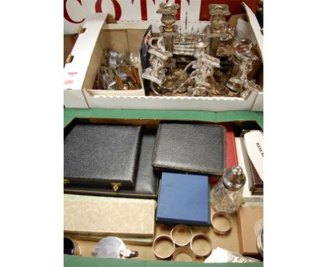 Assorted plated wares to include a pair of three light table candelabra, cased flatwares, napkin rings, etc