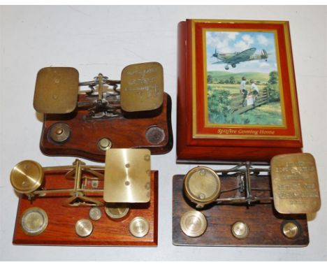 Three sets of Post Office scales and weights together with a table top trinket box, depicting a Spitfire coming home