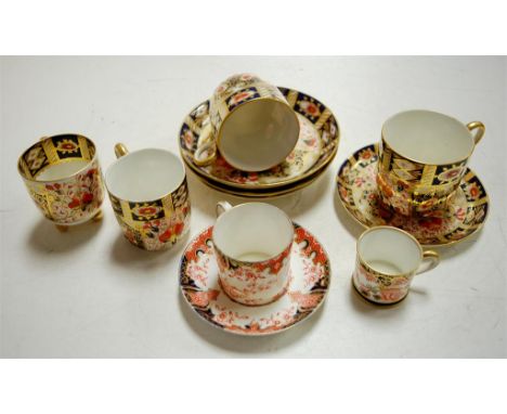 A small quantity of 19th century Davenport cups and saucers decorated in the Imari palette and heightened in gilt, and two ot