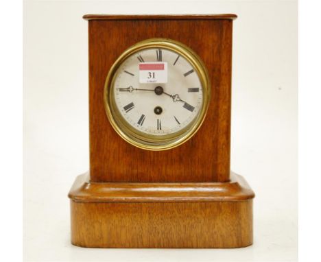 A late 19th century oak cased mantel clock, having French brass eight day cylinder movement
