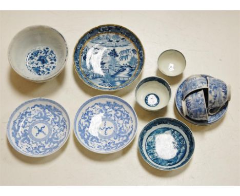 An 18th century Worcester porcelain tea-bowl, underglaze blue printed in the Fence pattern; and other blue and white printed 