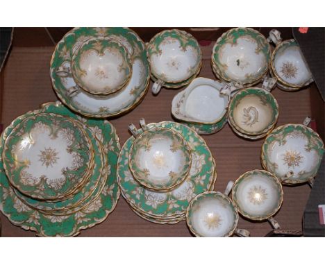 A Victorian part tea service having green floral and gilt decoration Condition Report / Extra Information Slop bowl - chip to