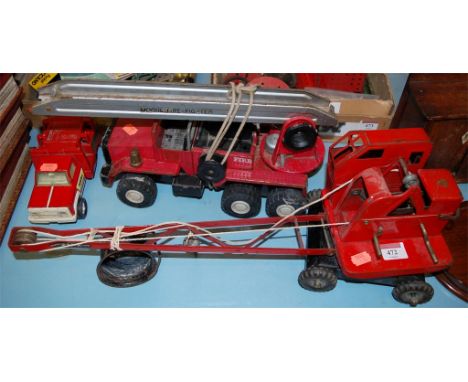 A Triang tinplate toy crane together with a Mogul fire fighter engine and a Tonka toy fire truck (3)
