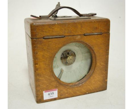 An early 20th century oak cased pigeon clock having a brass plaque with presentation inscription