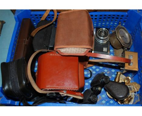 Mixed lot to include box brownie camera, modern brass sextant, and a travelling clock etc