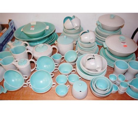 A large collection of assorted Poole pottery two tone table wares