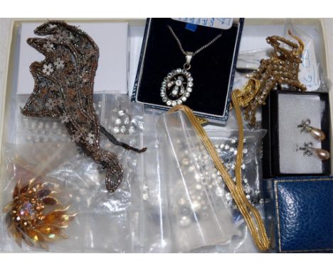 A collection of Art Deco and later costume jewellery to include drop pendant earrings, silver bangle, etc