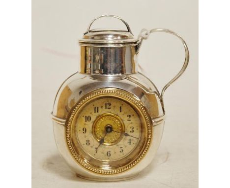 A silver plated novelty mantel clock in the form of a jug  Condition Report / Extra Information Handle to cover slightly miss