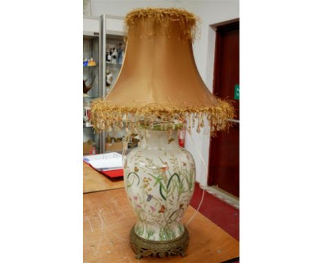 A reproduction crackle glazed soft paste porcelain table lamp with brass mounts and silk shade