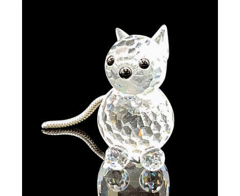 Faceted crystal in round body, head and feet, pointed crystal ears, black crystal eyes and nose. Silver coiled tail. Swarovsk
