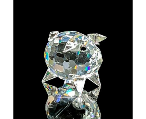 Clear faceted crystal figure of a little pig with black eyes. Swarovski mark. Item number 7657NR27. Part of the Peaceful Coun