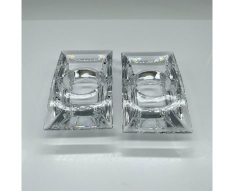 Stunning candle holders with a graceful sloping top and a square base. This item has its original box which measures 6"L x 4"