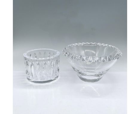 Two clear crystal bowls. V shaped bowl with etched rim 4"H x 7" dia. Smaller bowl with leaf pattern in bas-relief on the oute